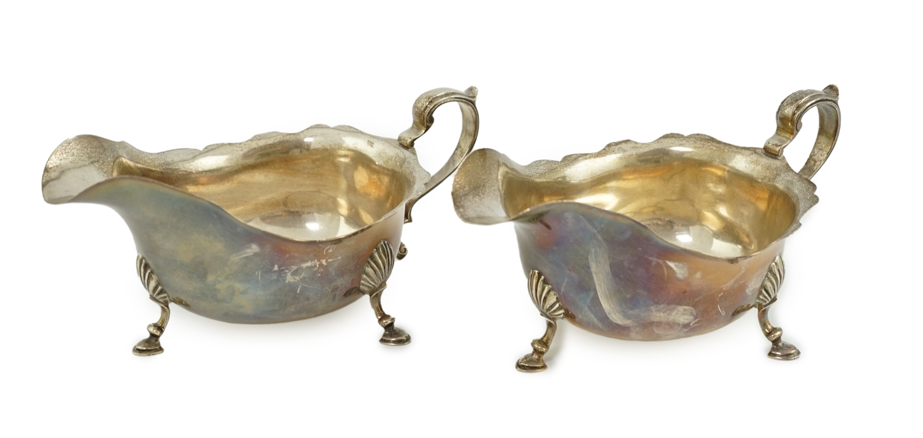 A pair of Elizabeth II silver sauce boats, maker A over HA